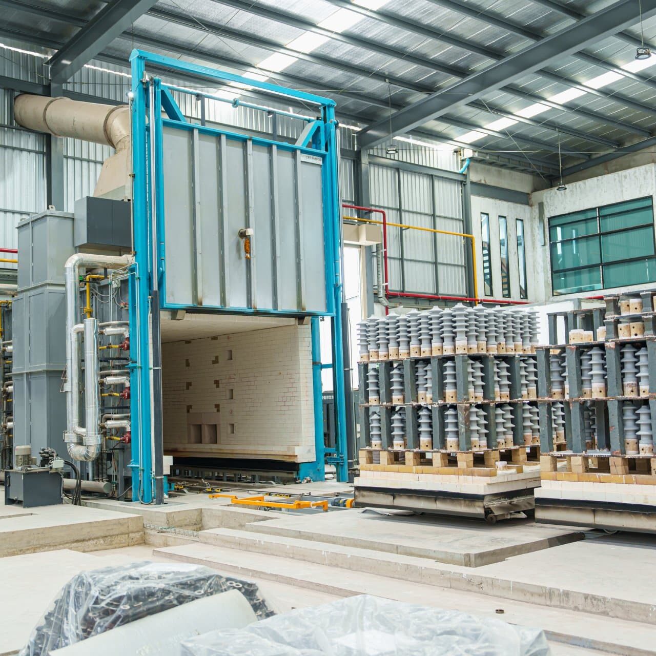 Ceramic sintering furnace, High strength electric insulator (Porcelain Insulator) Raw ceramic products without glaze at ceramic factory in the workshop